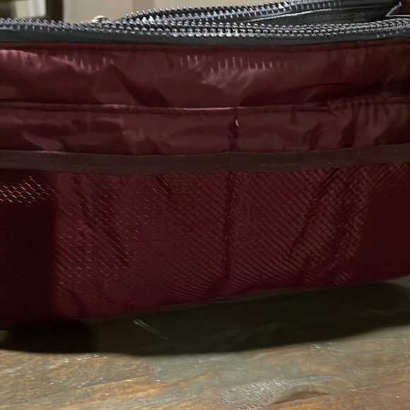 Travel maroon toiletry bag. 10” long by 6” tall. - Picture 6 of 9